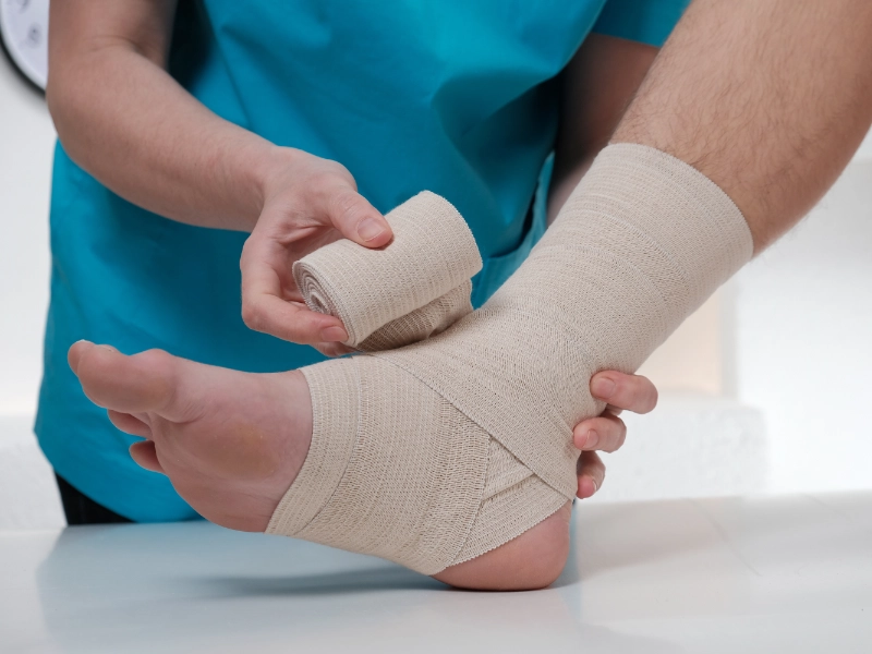 A foot being wrapped in bandages